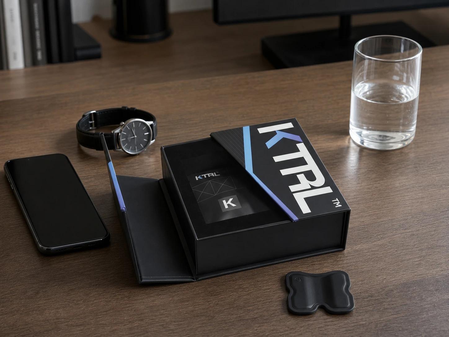 KTRL on a desk alongside everyday items