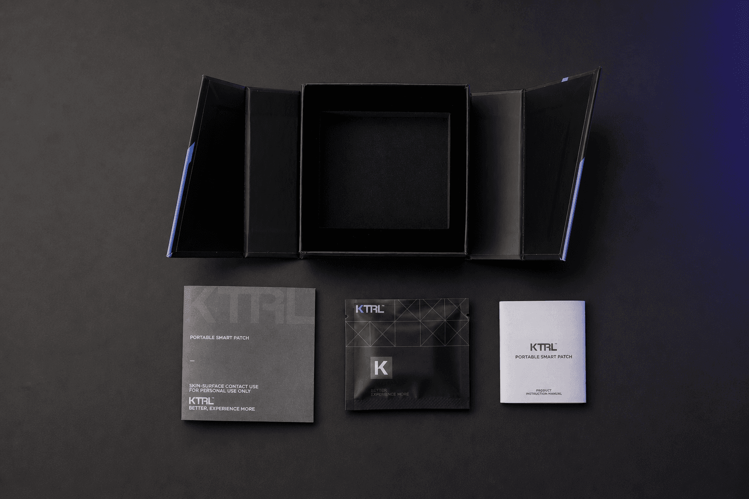 KTRL Portable Smart Patch packaging with an open box, product insert, sealed pouch and instruction manual.
