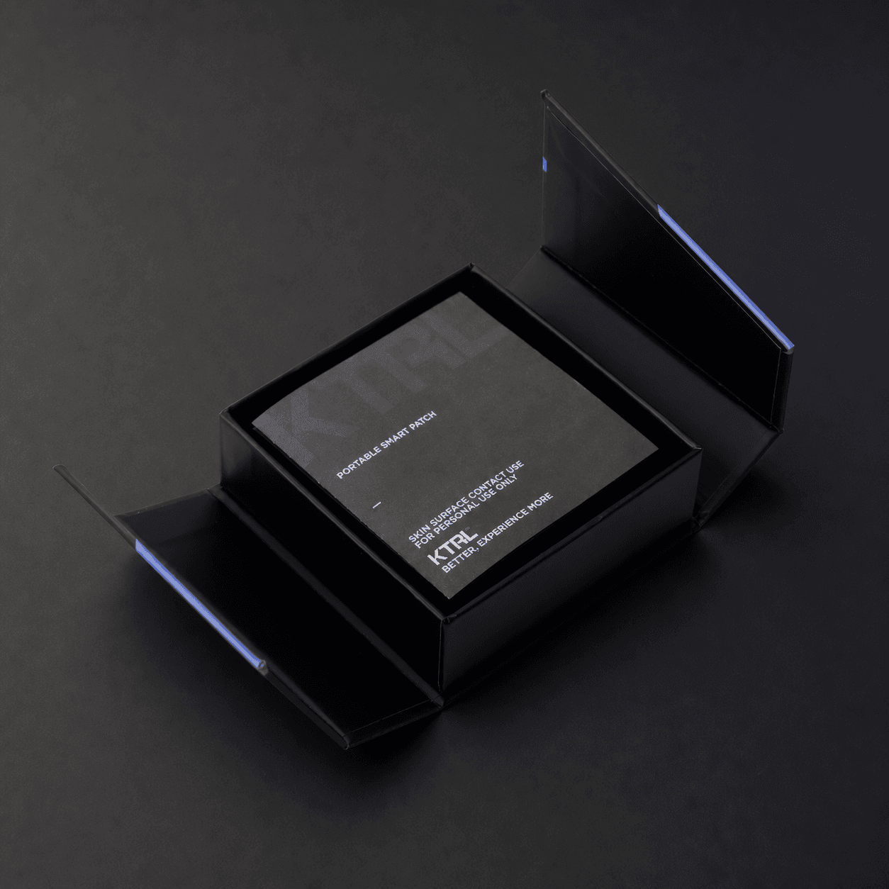 Open KTRL Portable Smart Patch box with a branded product insert inside.